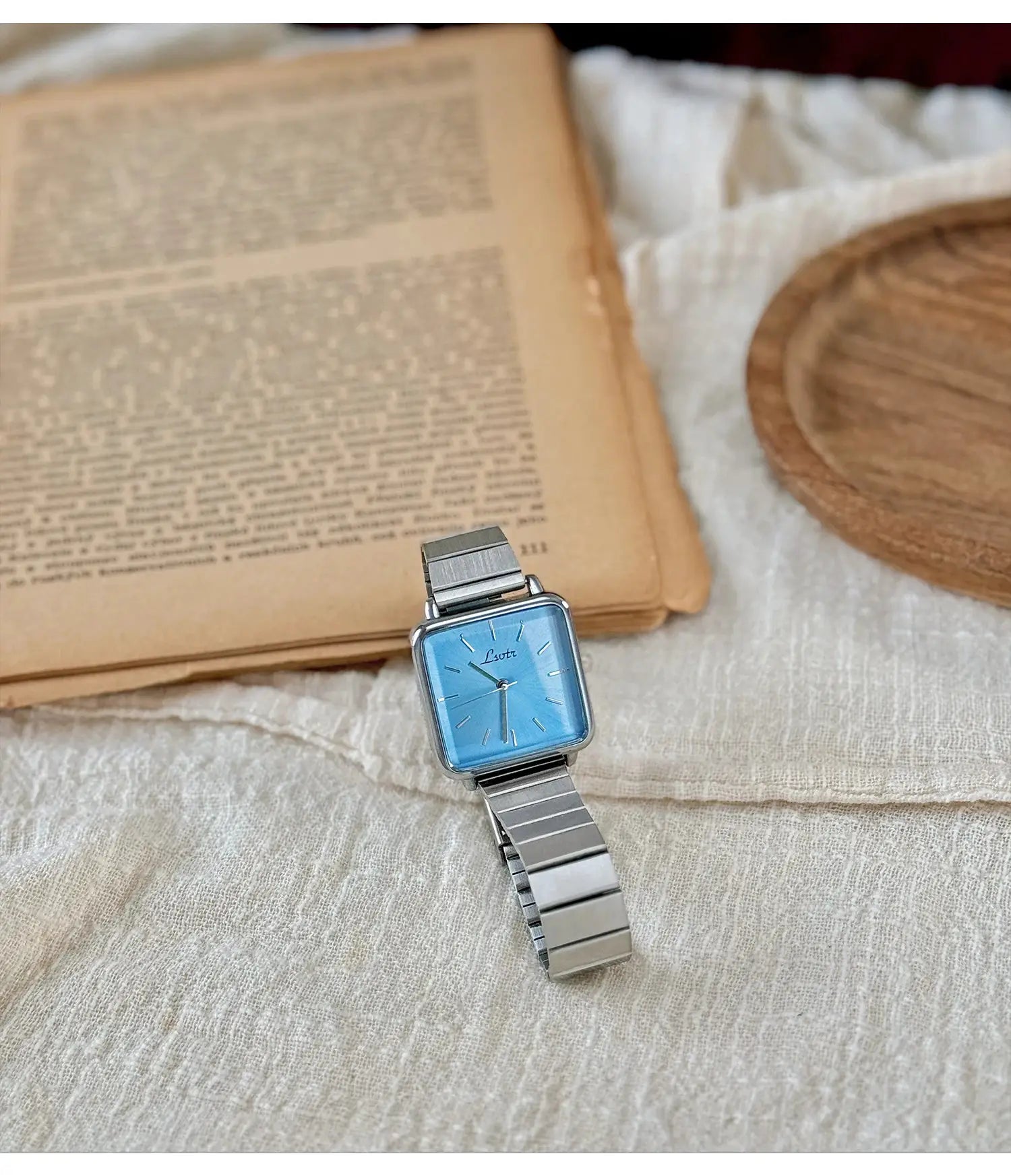 Simples Market women's square-dial stainless steel watch with blue face.