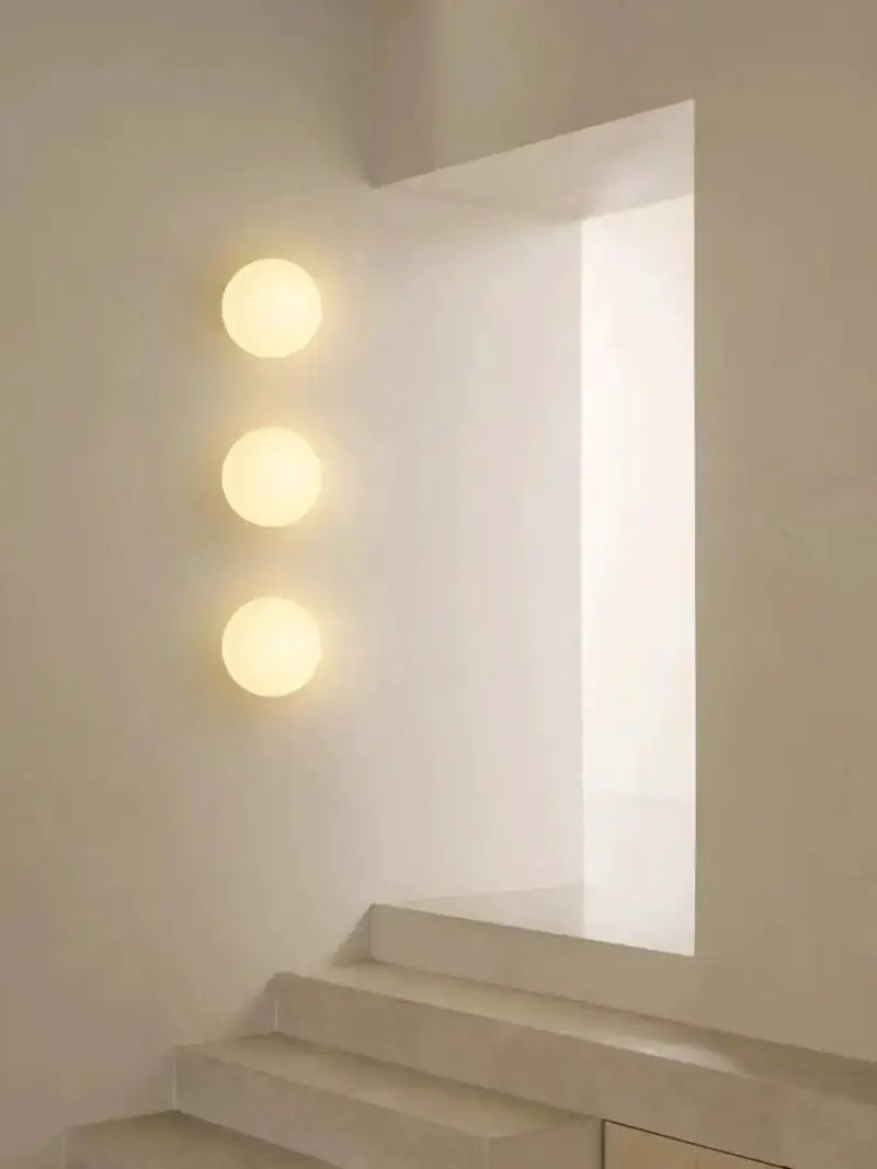 Simples Market Milky White Glass Ball Wall Lamp; three frosted glass spheres mounted vertically for ambient lighting