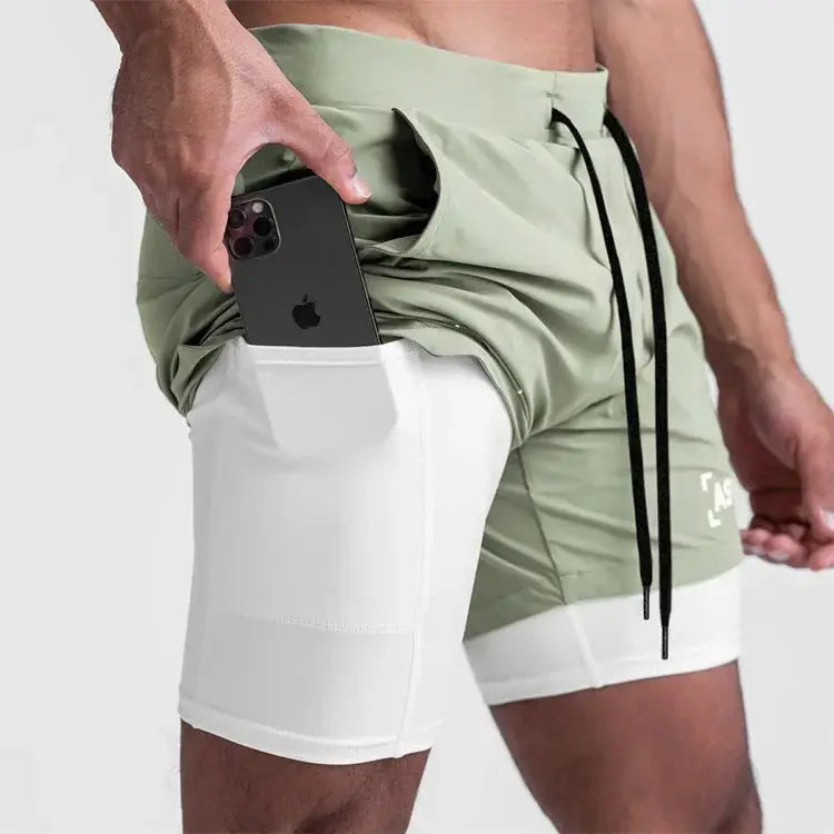 ASRV Mens Quick Dry 2-in-1 Double-deck Shorts, green outer with white inner lining, phone in pocket