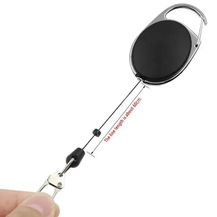 Retractable key chain badge reel by Simples Market with quick-release clip; black round reel