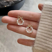Hollow-out round rhinestone bow stud earrings pair for women with imitation pearls, gold-tone finish