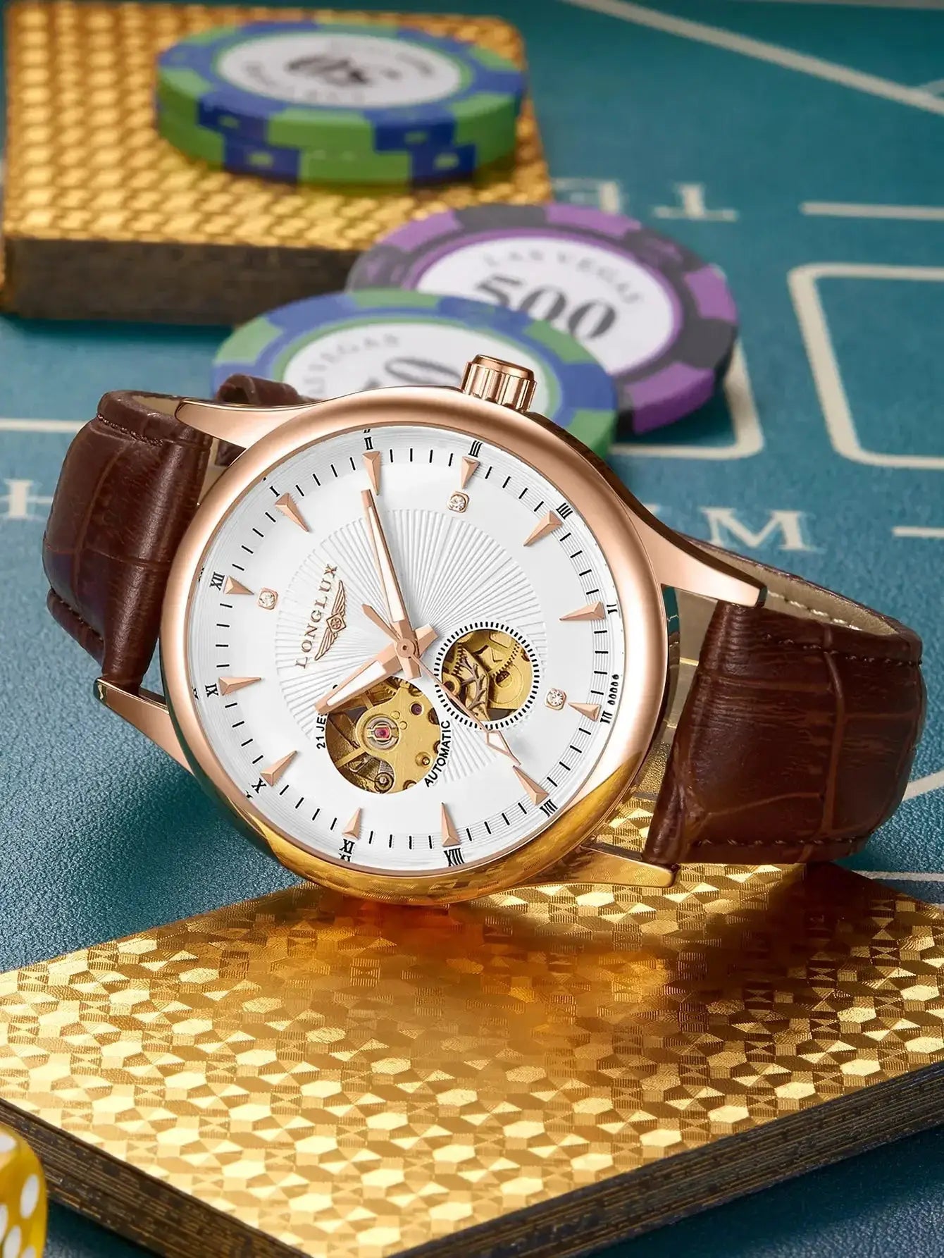 Rose gold-tone skeleton automatic watch with brown leather strap and visible gears on a white dial beside poker chips