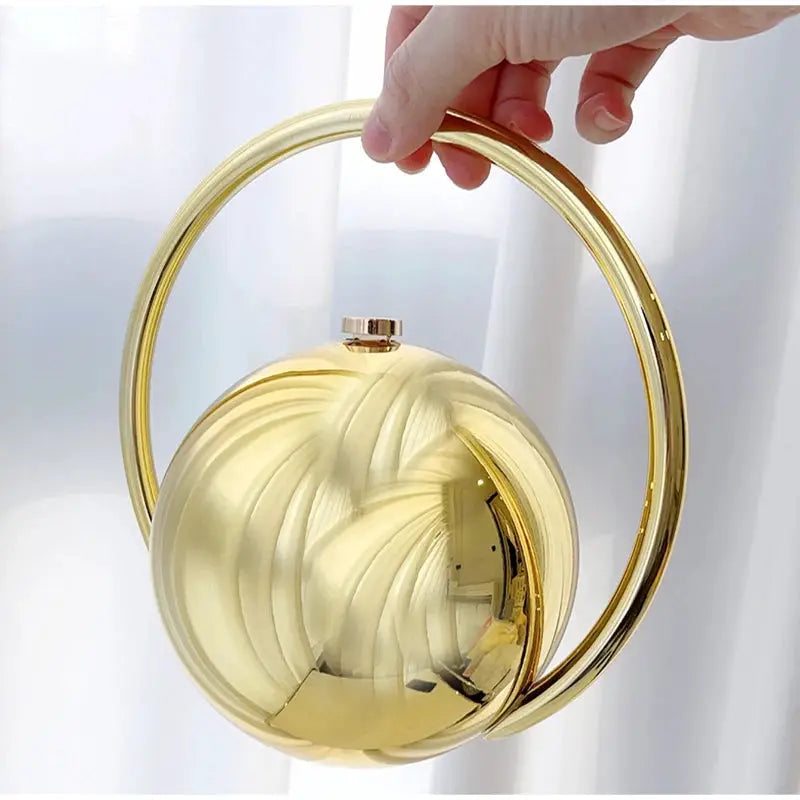 Luxury designer evening clutch with ball handle, gold acrylic circular purse