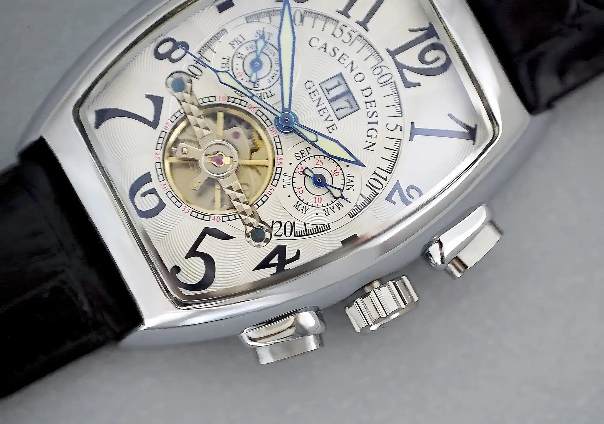 CASENO men's skeleton tourbillon watch with calendar, blue hands, tonneau silver case.