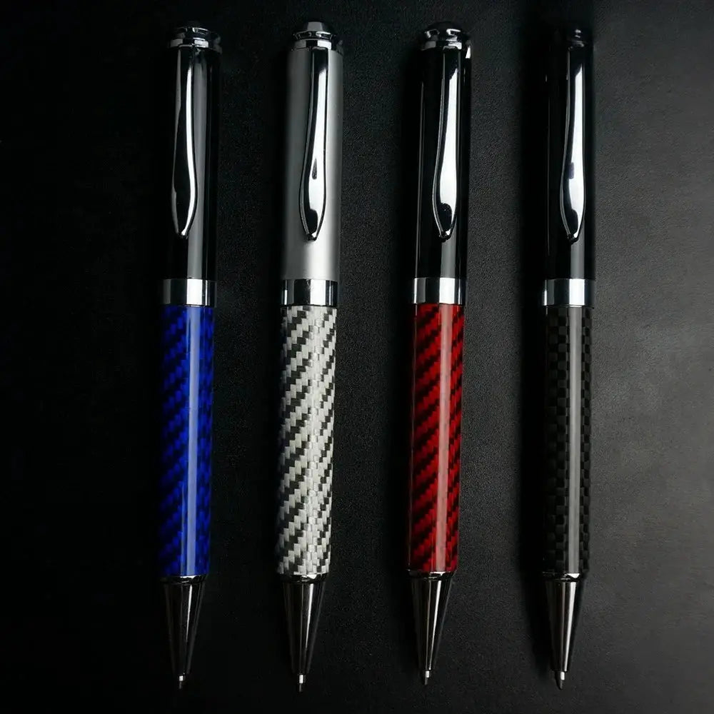 Carbon fiber signature pen set by Simples Market with four metal gel ink pens in blue, silver, red, and black.