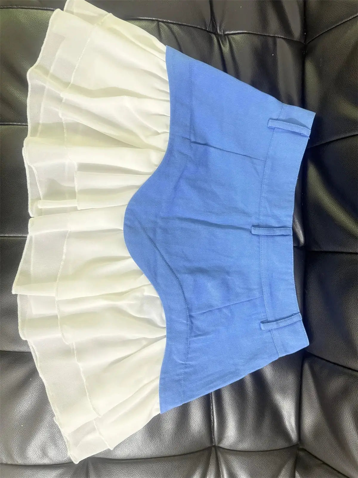 Blue high-waisted pleated splice midi skirt with white pleated panel