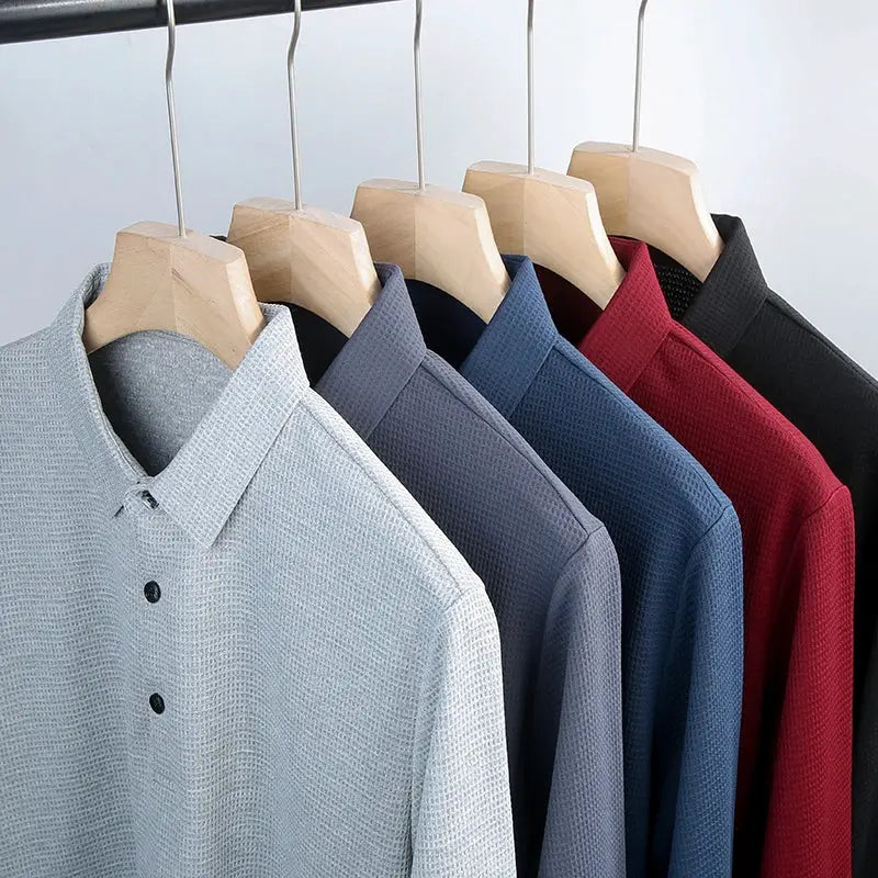 Men's business casual polo long-sleeve shirts in 7 colors (light gray to black) on wooden hangers