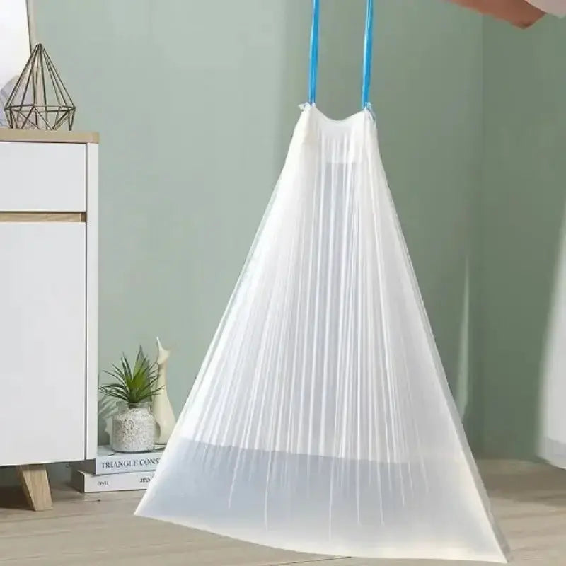 Simples Market drawstring trash bag, large translucent thick plastic with blue cords hanging

