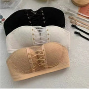 Three lace strapless bras in black, white and nude with front lace-up corset detail.