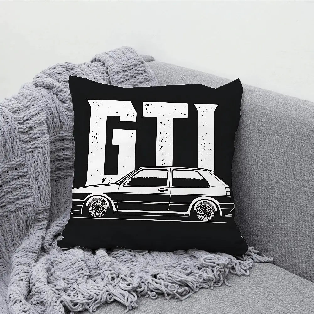 G-Golf G-GTI car pillow case, black cover with white car graphic and large GTI letters on a grey sofa