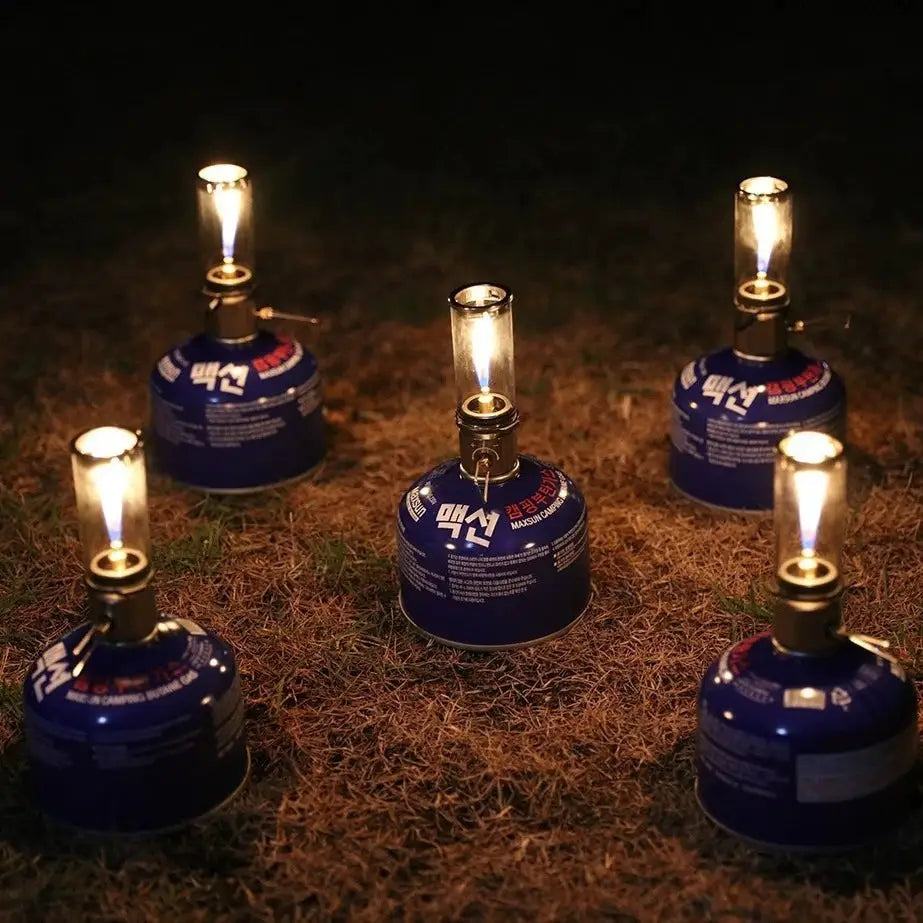 Dreamlike Candlelight Lamp BRS-55, Simples Market windproof gas burner camping stove; five blue canisters with flames.