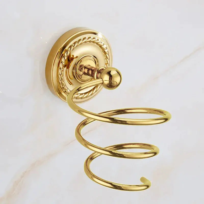 Gold brass towel ring by Simples Market with ornate backplate