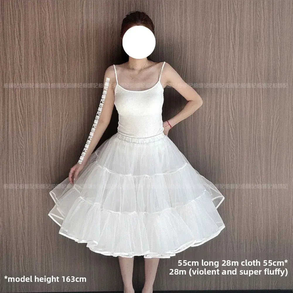 White multi-tier Lolita petticoat crinoline with fluffy mesh, worn by a model in a white tank top.