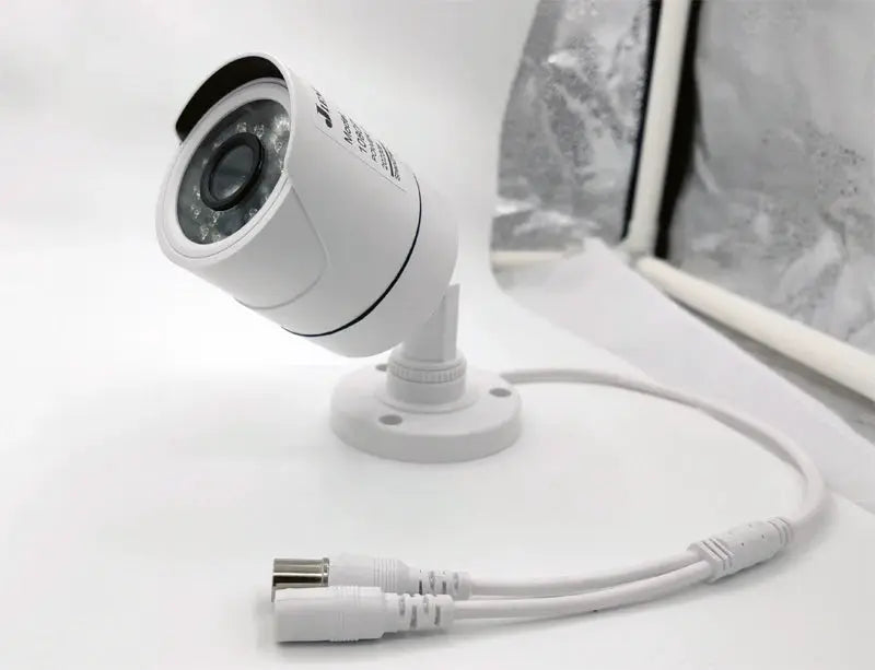 JIENUO white 4K AHD CCTV security camera on mounting base with cables