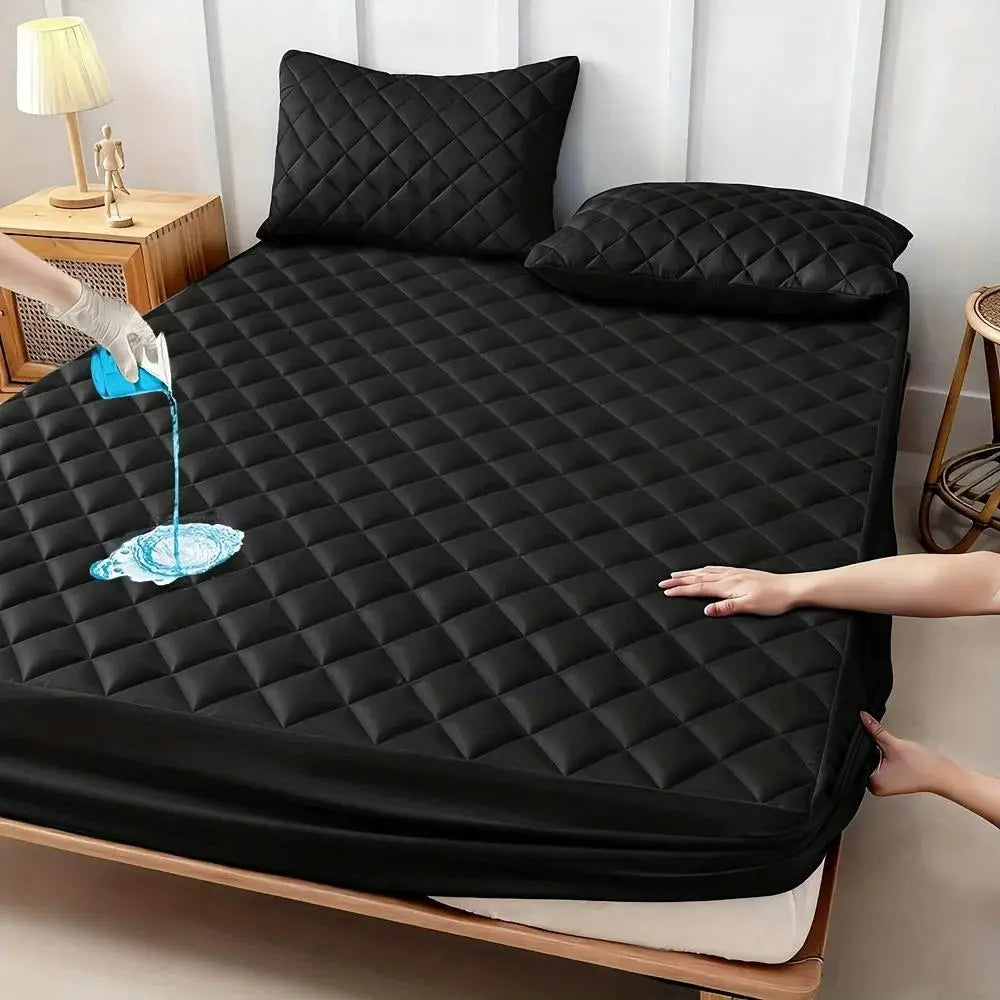 Simples Market black quilted waterproof mattress protector on bed; thick, breathable, noiseless pad.