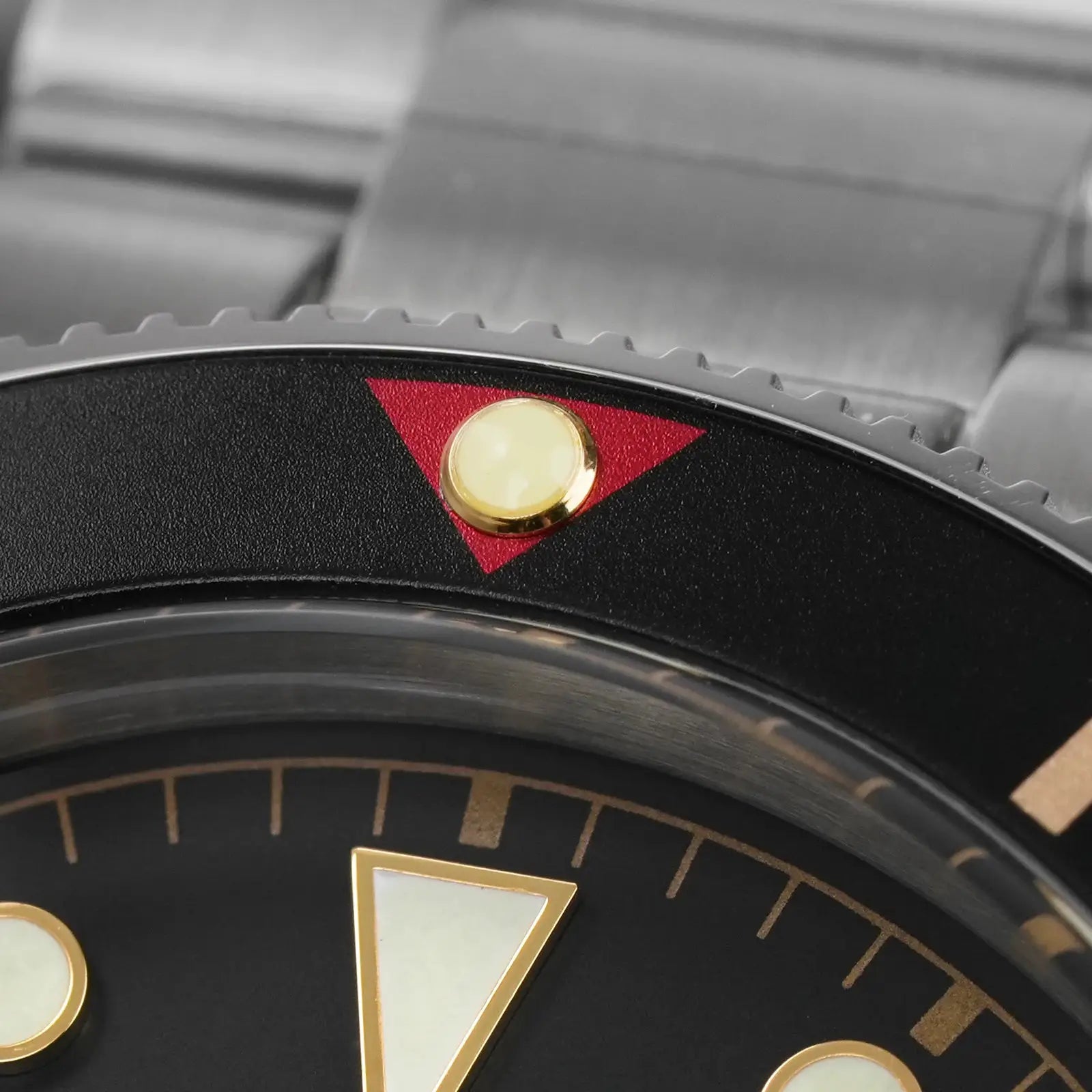 Watchdives WD7922 BB54 watch with black dial, gold markers and red triangle accent.