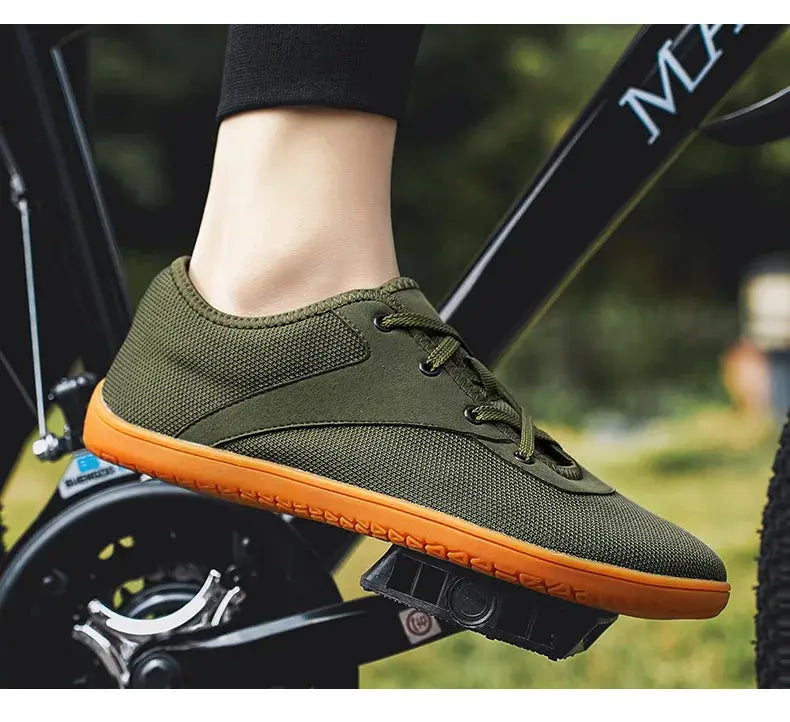 Simples Market men's trail running shoe, olive-green mesh upper with orange sole; minimalist, wide-width, zero-drop