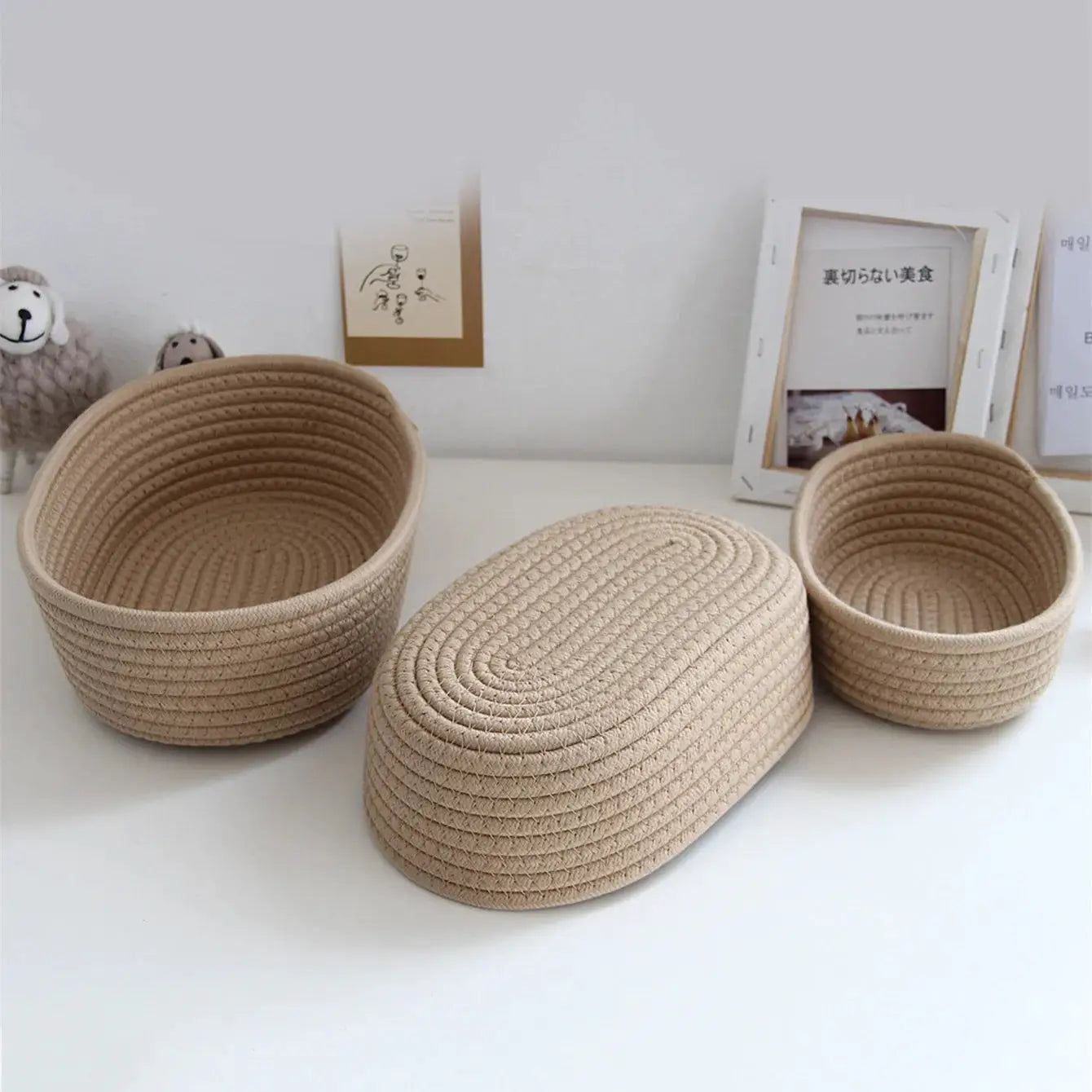 Woven storage baskets set of 3 by Simples Market in natural beige jute for cosmetics, toys, and desk items.