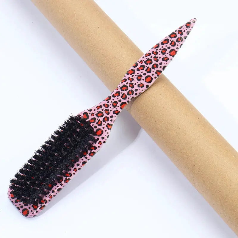 Slick Back Hair Brush by Simples Market, pink leopard-print handle with black bristles.