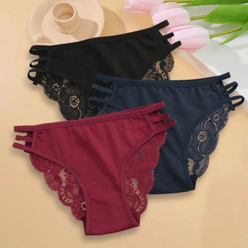 3-pack women's low-rise lace panties with floral lace trim and hollow-out side straps in black, navy, and burgundy