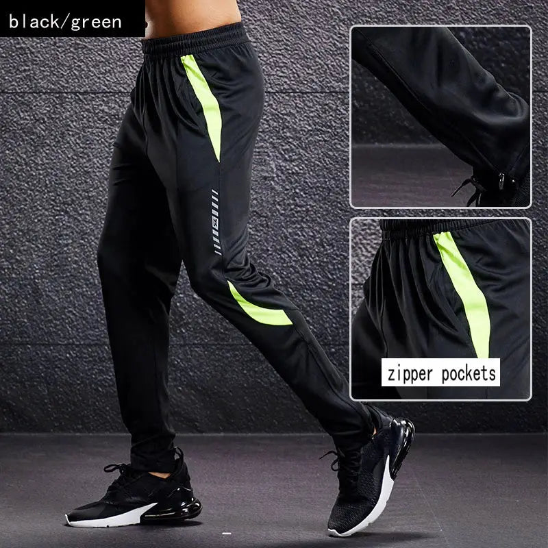Men's sport pants in black with neon lime side stripes and zip pockets for running and training