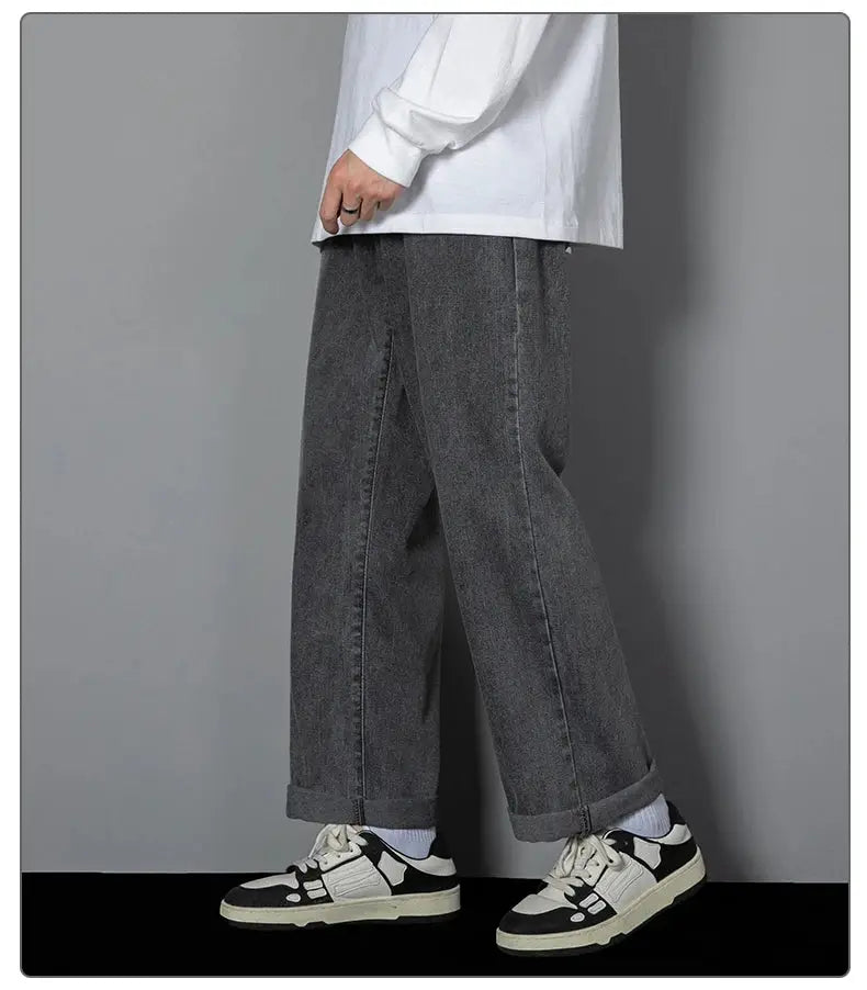 Men's dark gray denim wide-leg jeans with cuffed hems, casual wear.