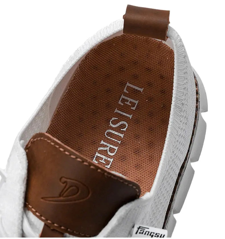 Men's white mesh casual shoes with brown leather tongue patch and LEISURE insole; breathable non-leather loafers.