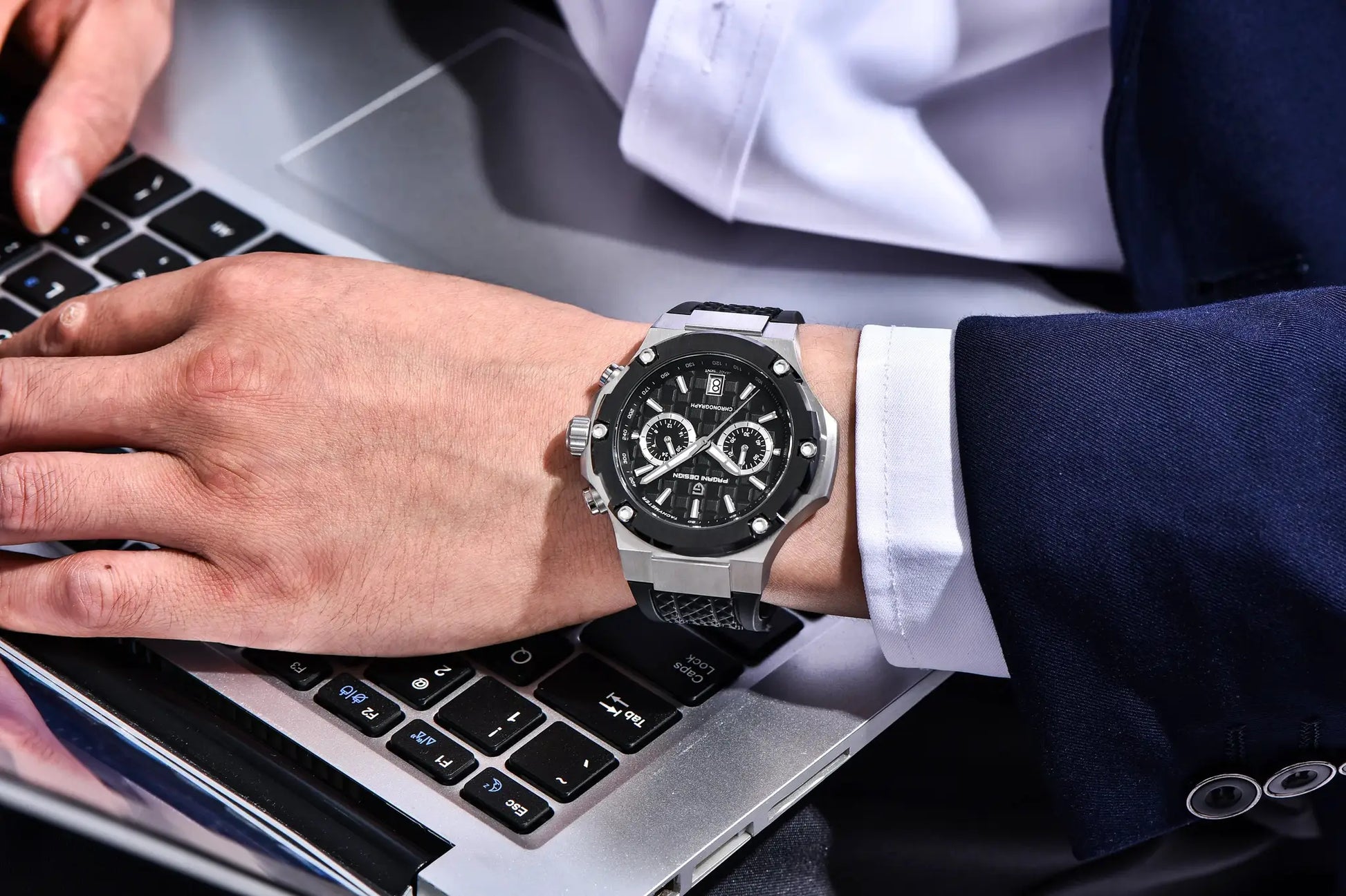 PAGANI DESIGN men's chronograph watch with silver case, black dial, fluororubber strap worn on wrist