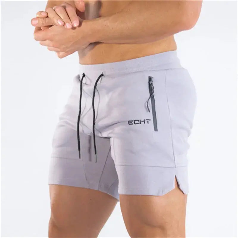 Men's gray gym shorts with zip pocket, drawstring waist, and side slit hem
