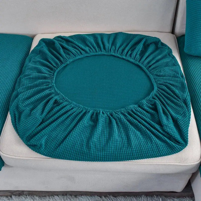 Polar fleece round sofa seat cushion cover, teal, with elastic edge.