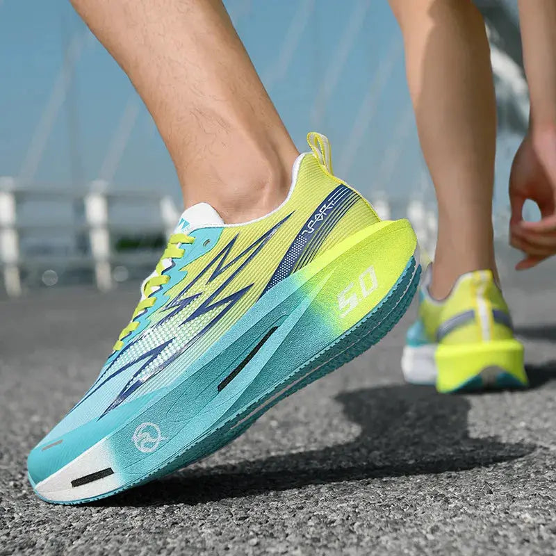 Pair of running shoes in blue-teal gradient with lime accents and breathable mesh
