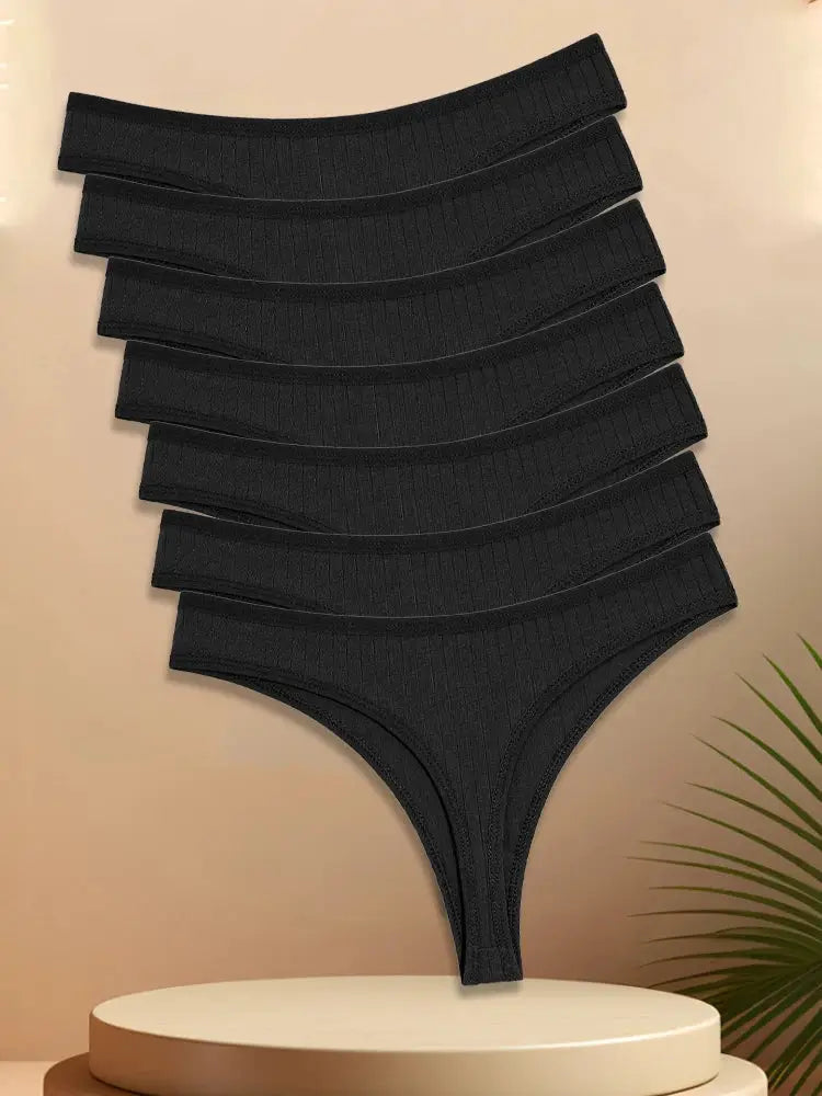 7-piece set of black cotton striped women's thongs with low-rise, breathable T-back.