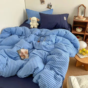 Bedding set: blue striped duvet cover with matching pillowcases and bedsheet