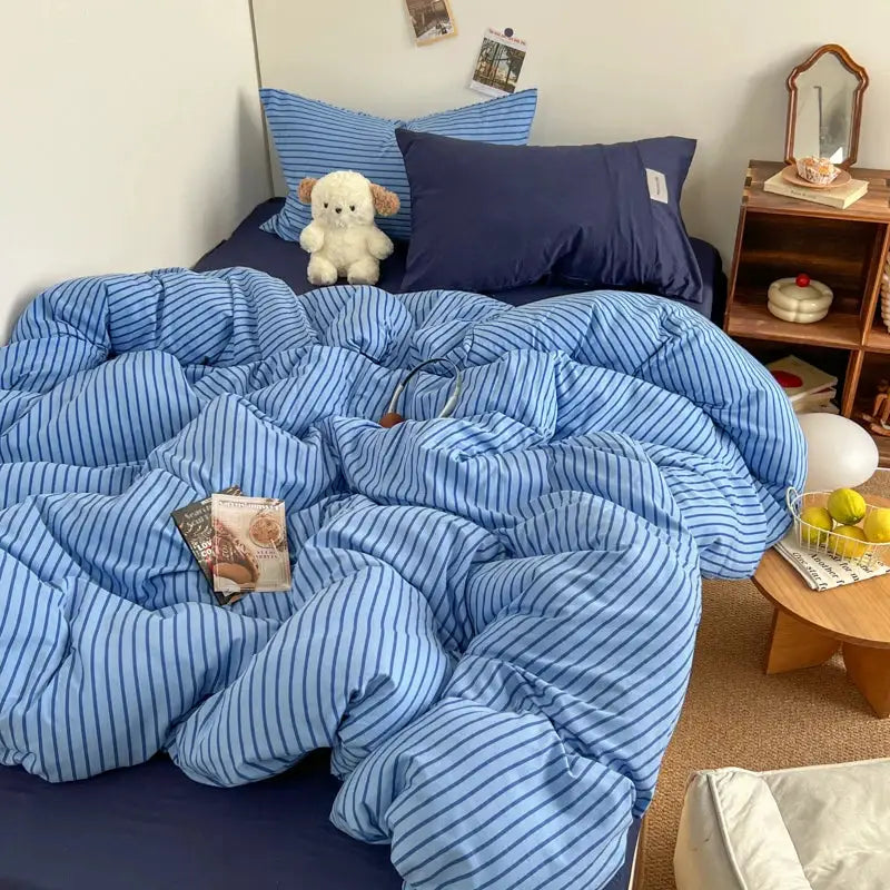Bedding set: blue striped duvet cover with matching pillowcases and bedsheet