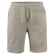 Men's beige cotton-linen shorts with drawstring waist, lightweight breathable fabric, casual streetwear-style summer bottoms