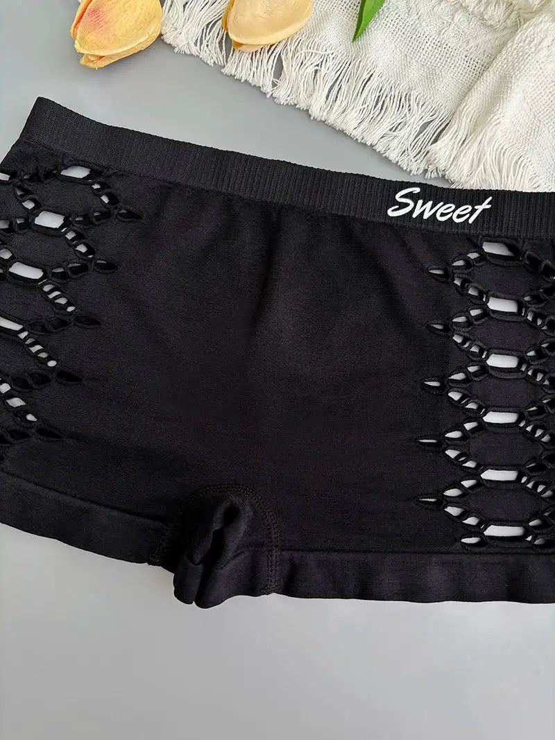 Black seamless underpants shorts with side mesh lattice panels; waistband reads Sweet.