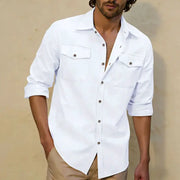 Men's white linen casual shirt with dual chest pockets, button-front, rolled sleeves.