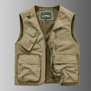 Men's tan utility vest by Simples Market with multiple pockets, zip front, and mesh lining.