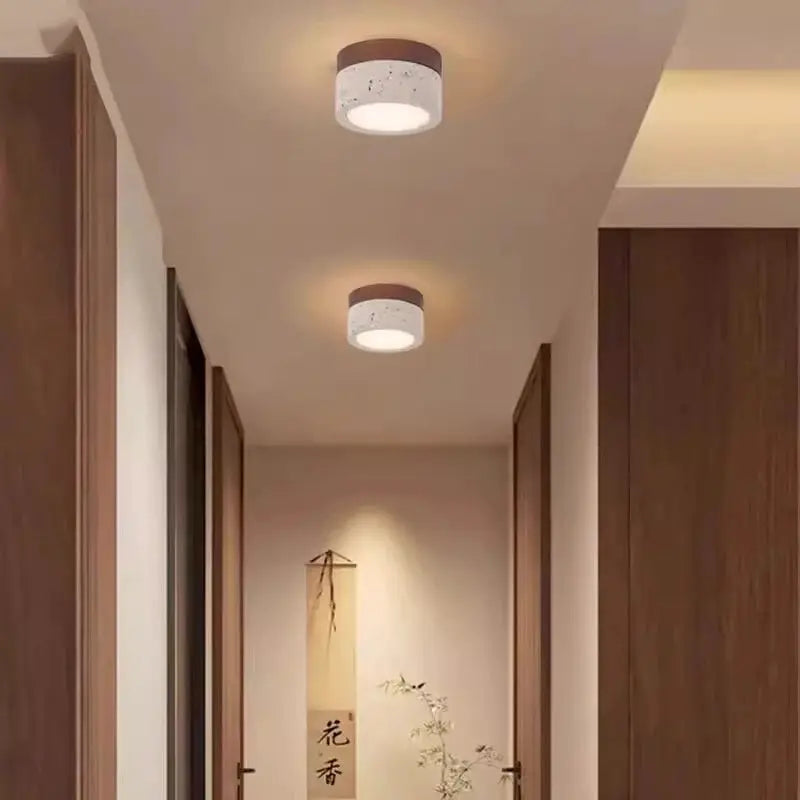 Japanese Wabi Sabi Stone LED ceiling light by Simples Market, cream with brown wood ring, two lights shown.