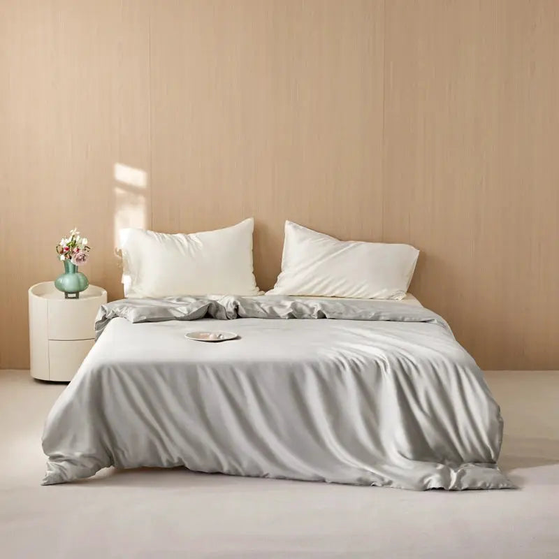 Eucalyptus Lyocell duvet cover in silver-gray on a neatly made bed with white pillows