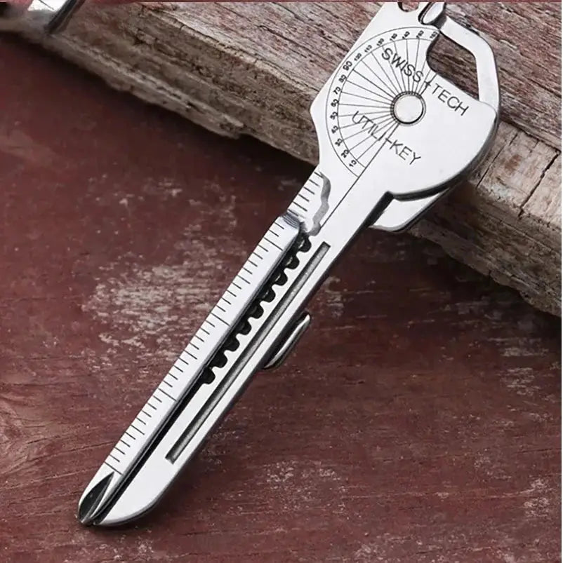 8-in-1 multi-tool keychain in silver metal with folding screwdriver, bottle opener and ruler