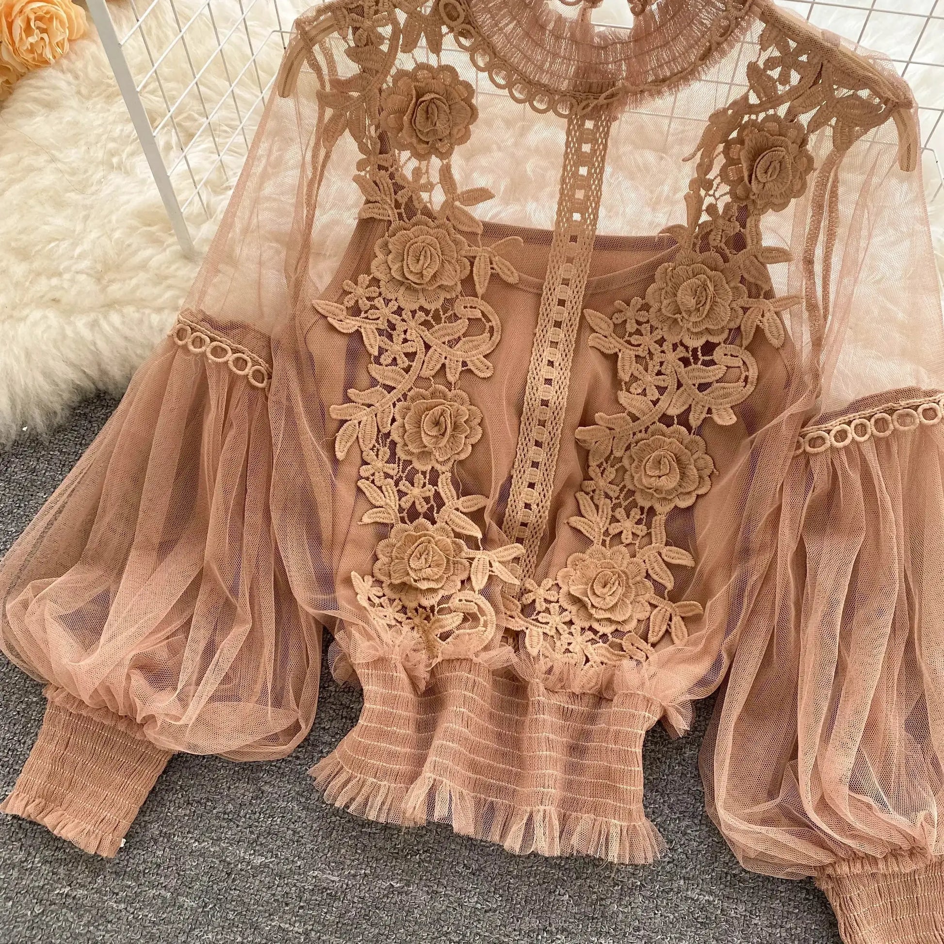 Lace puff long-sleeve blouse in dusty pink with floral applique and sheer mesh.