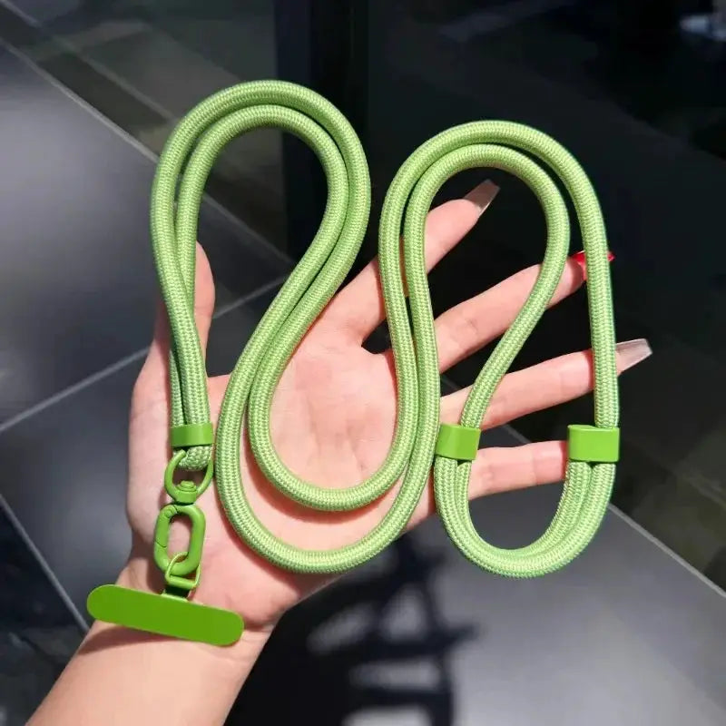 Phone lanyards by Simples Market: two neon-green braided straps with clips