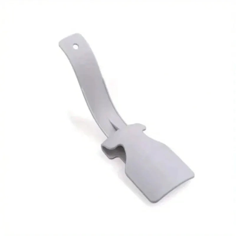 Plastic gray shoehorn by Simples Market, a lazy shoe aid that fits all shoes