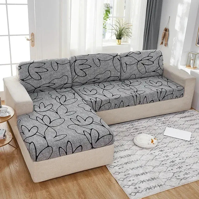 1-piece elastic seat cushion cover for sofa by Simples Market, grey fabric with black abstract leaf pattern, washable.