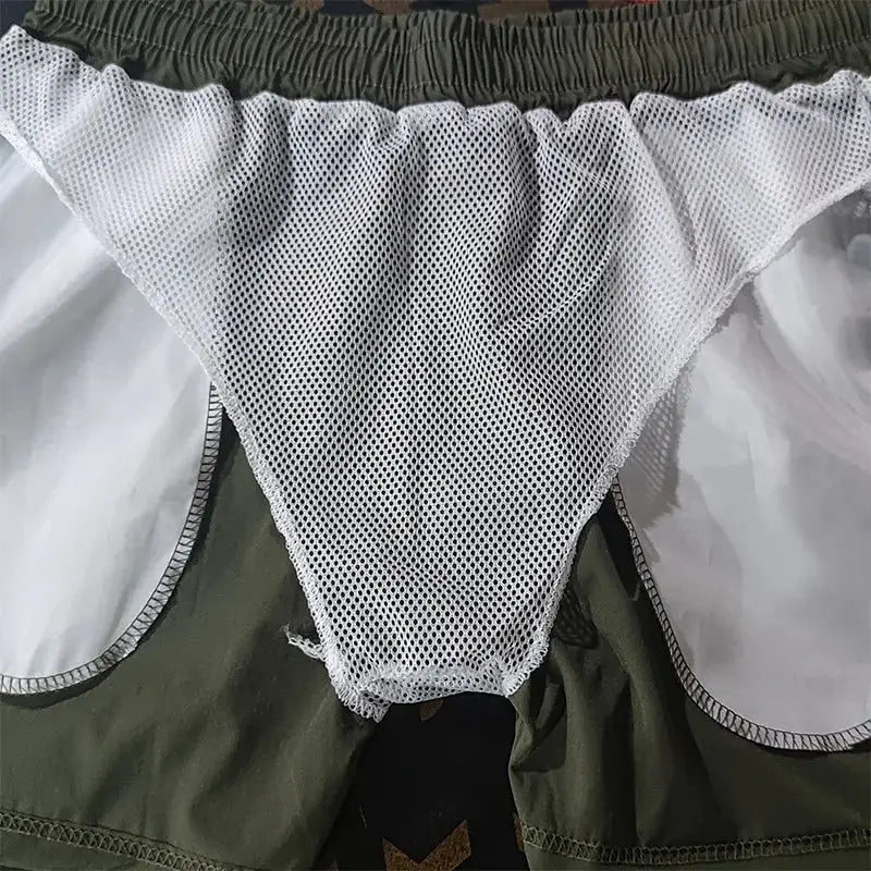 Men's swimming trunks by Simples Market; green outer fabric with white mesh inner lining