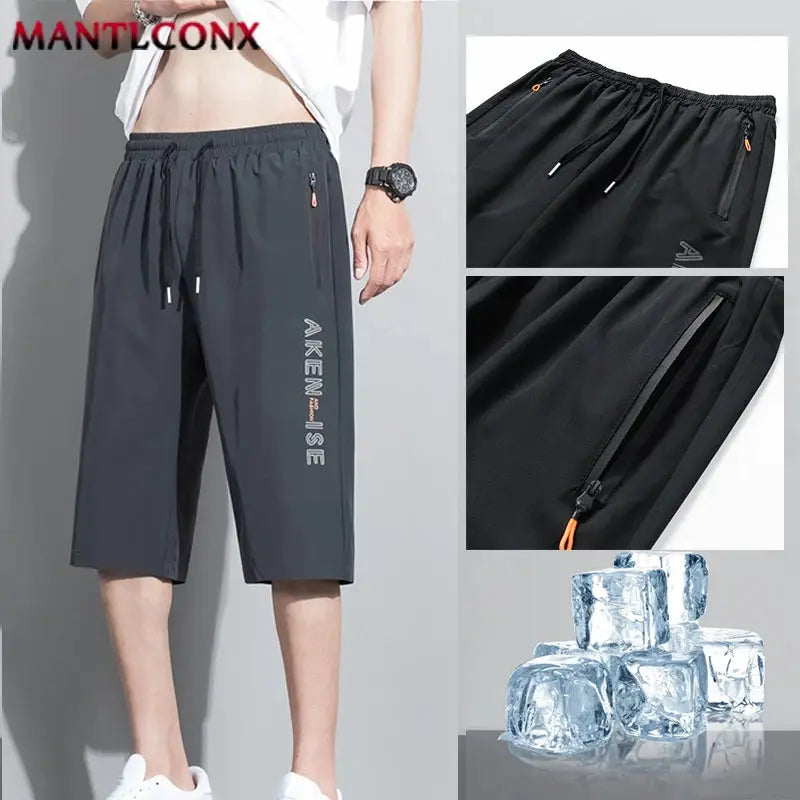 Men's black athletic shorts with elastic waist and zip pockets, MANTLCONX