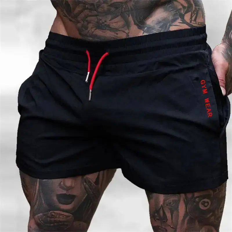 Men's black gym shorts with red drawstring, lightweight quick-drying fabric, side GYM WEAR text.