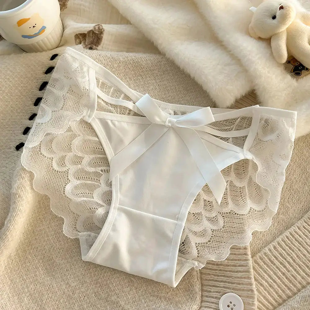 Women's white lace panties with satin bow and scalloped lace sides, mid-low rise