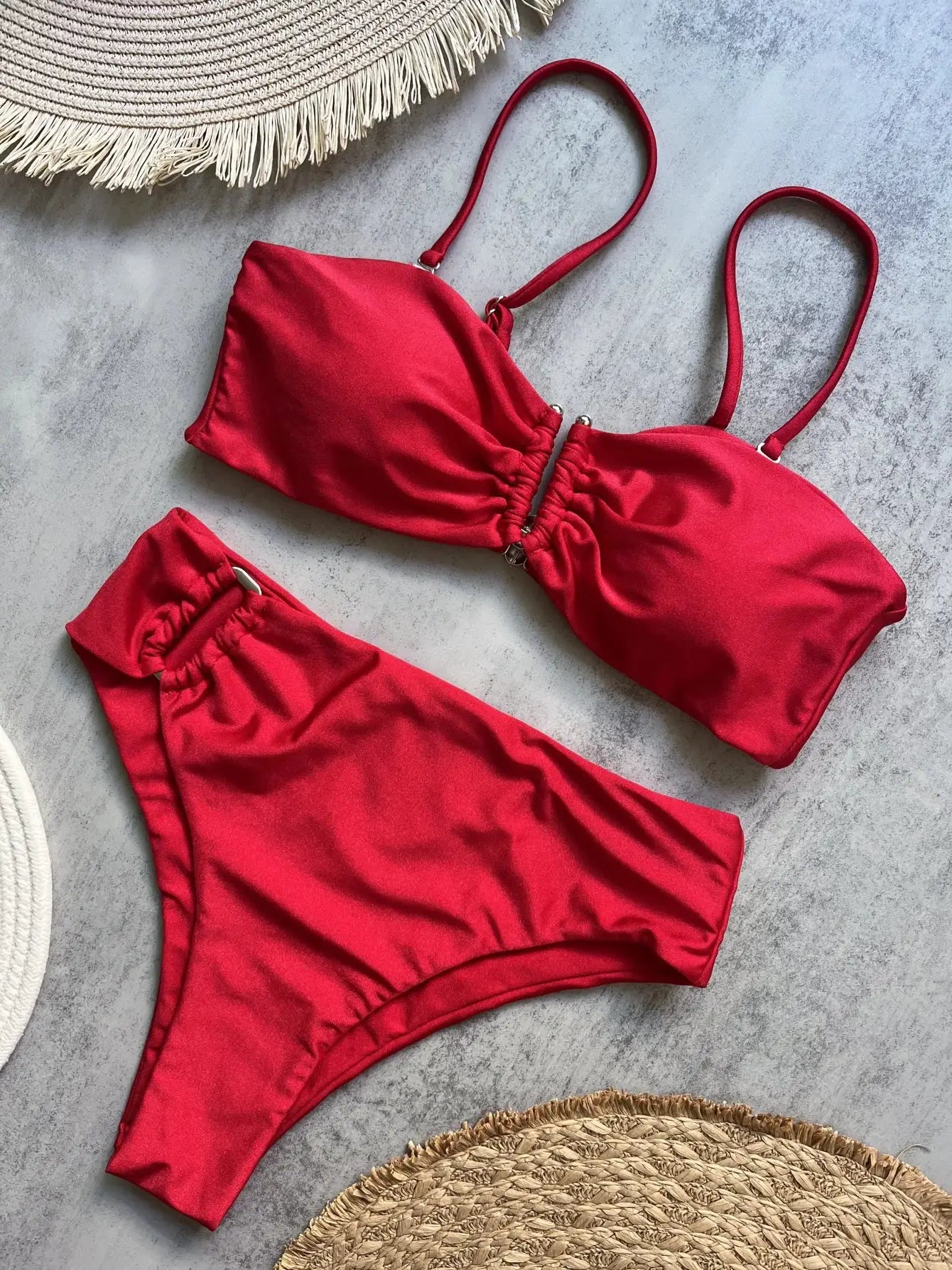 Solid red bandeau bikini set with adjustable straps and ruched center, matching bottoms.